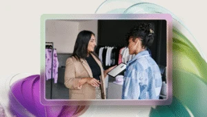 Azure solution in retail store. Retail business operations manager reviewing real time data with employee.