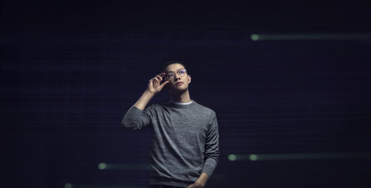 Asian male developer standing hero portrait with Azure geometries as textures in the background, code, developer, engineer, Azure.
