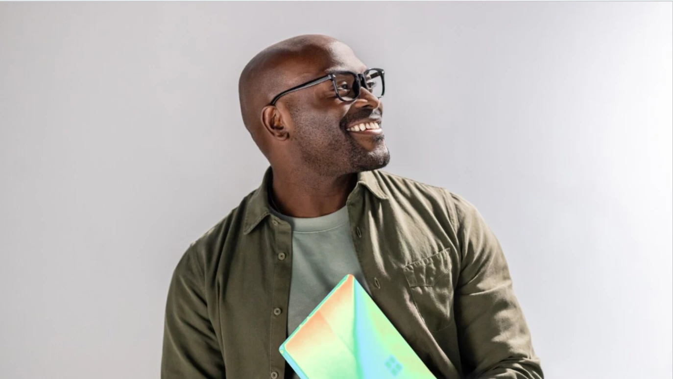 A man holding a laptop.