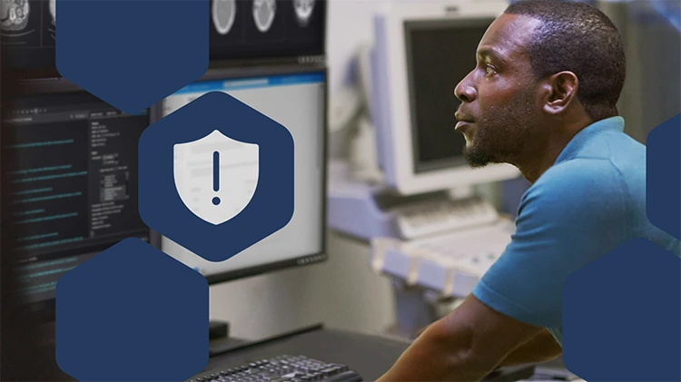 Photo of healthcare employee looking at computer